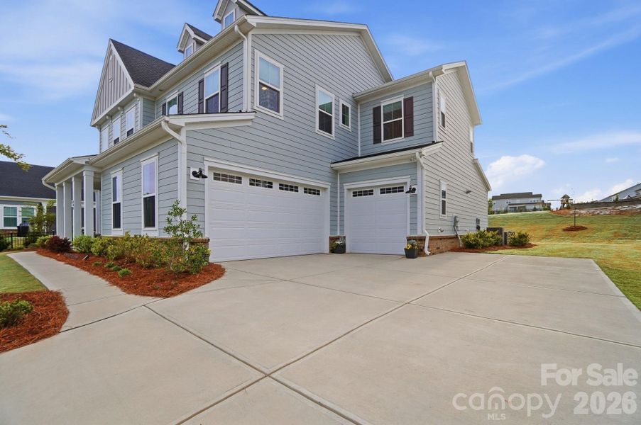 Front exterior of a new home in , Belmont, NC, highlighting curb appeal (Image 22).