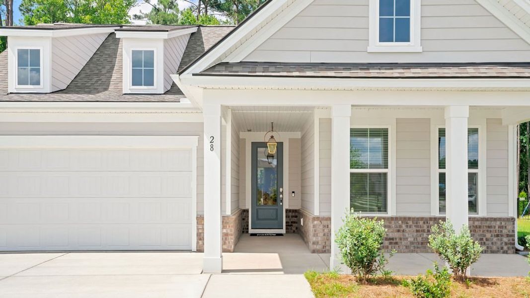 Exterior details and patio area of a home in Midpoint at New Riverside, Bluffton (Image 3). Exterior details and patio area of a home in Midpoint at New Riverside, Bluffton (Image 3).