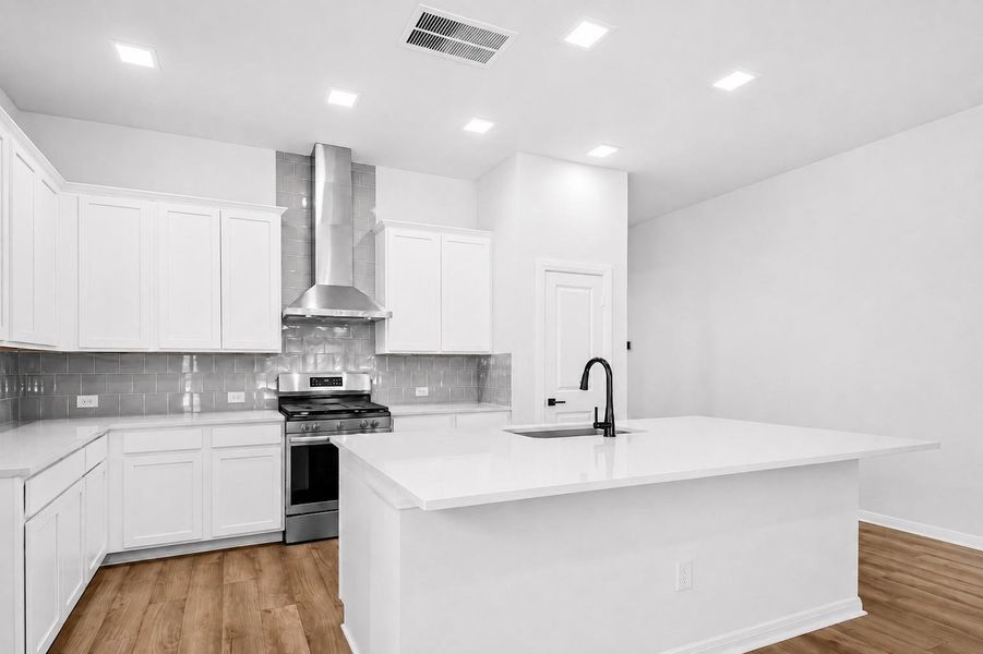 Kitchen (Photos shown are from a complete home with the same floorplan and similar design selections. Actual design selections may very slightly)