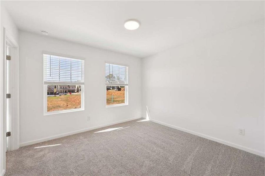 Spacious, unfurnished interior of a new home in Eastlyn Crossing, Flowery Branch (Image 24).