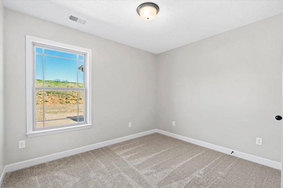Representative unfurnished interior of a home built from the Wellford by Enchanted Homes in Hampshire Heights, Moore (Image 16).