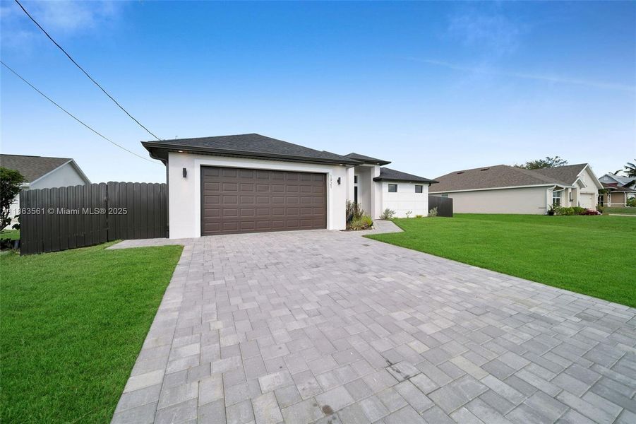 Front exterior of a new home in , Cape Coral, FL, highlighting curb appeal (Image 19).