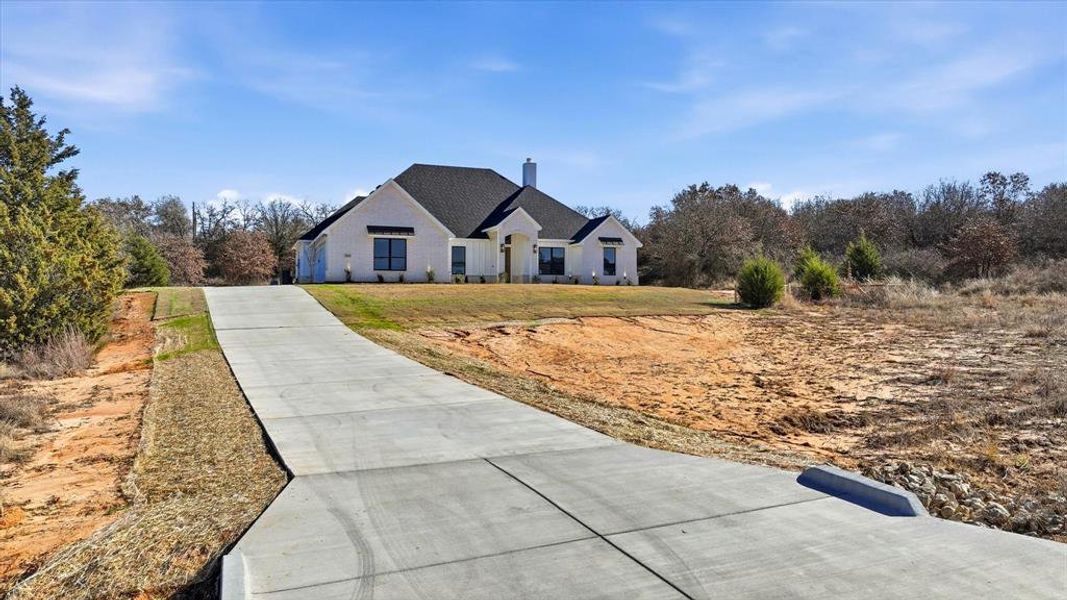 Front exterior of a new home in , Peaster, TX, highlighting curb appeal (Image 22).