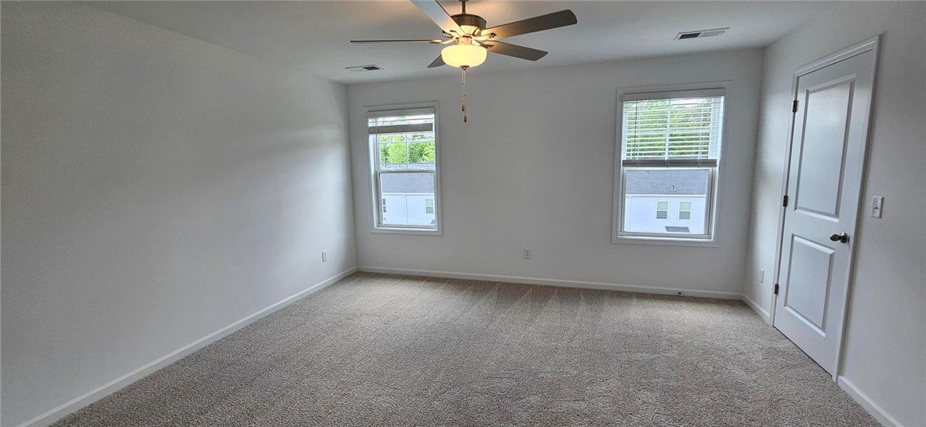 This spacious room features ample natural light an This spacious room features ample natural light an