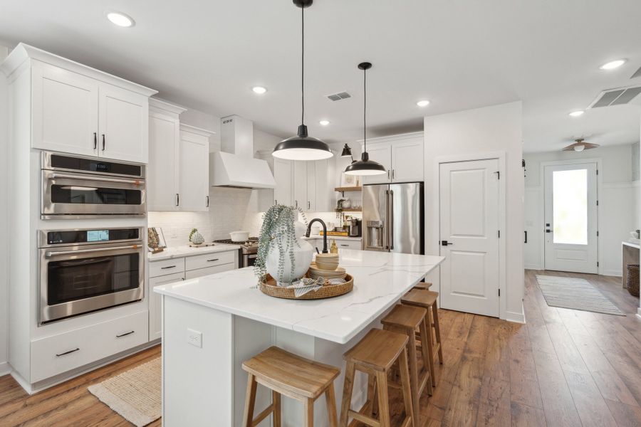 Kitchen with pendant lights over island