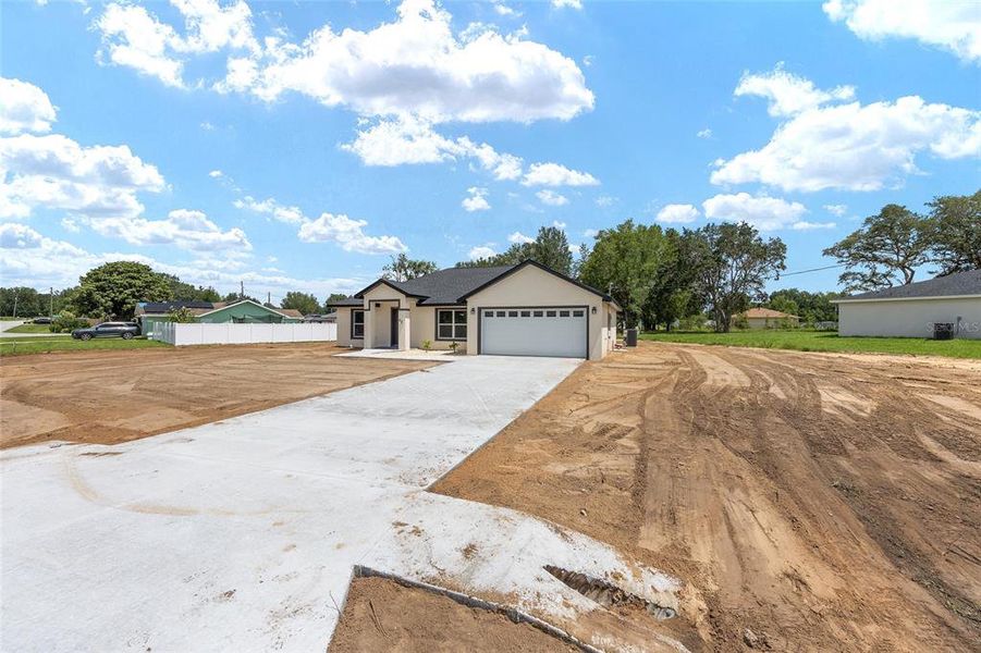 Front exterior of a new home in , Ocala, FL, highlighting curb appeal (Image 31). Front exterior of a new home in , Ocala, FL, highlighting curb appeal (Image 31).