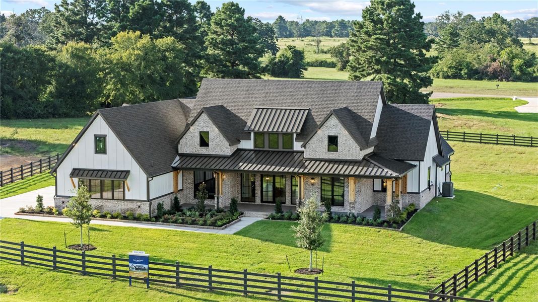 Front exterior of a new home in , Montgomery, TX, highlighting curb appeal (Image 22). Front exterior of a new home in , Montgomery, TX, highlighting curb appeal (Image 22).