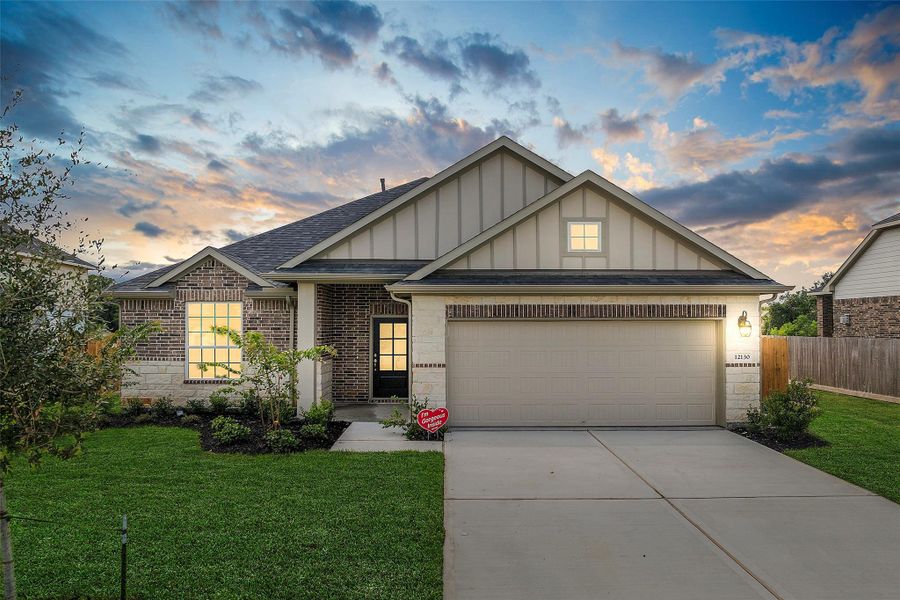 Front exterior of a home in the Champions Forest 90' community, located in Mont Belvieu, TX (Image 10).