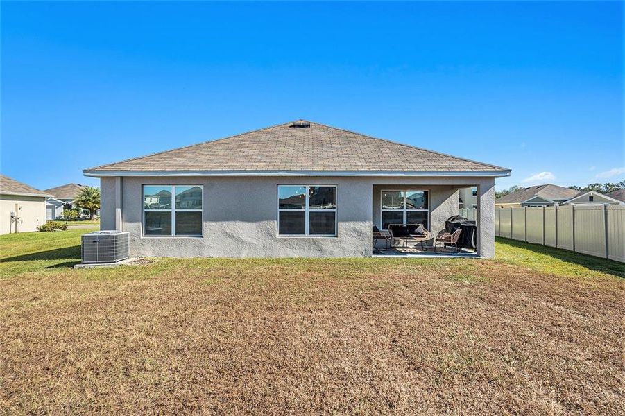 Exterior details and patio area of a home in Bella Lago, Parrish (Image 2).
