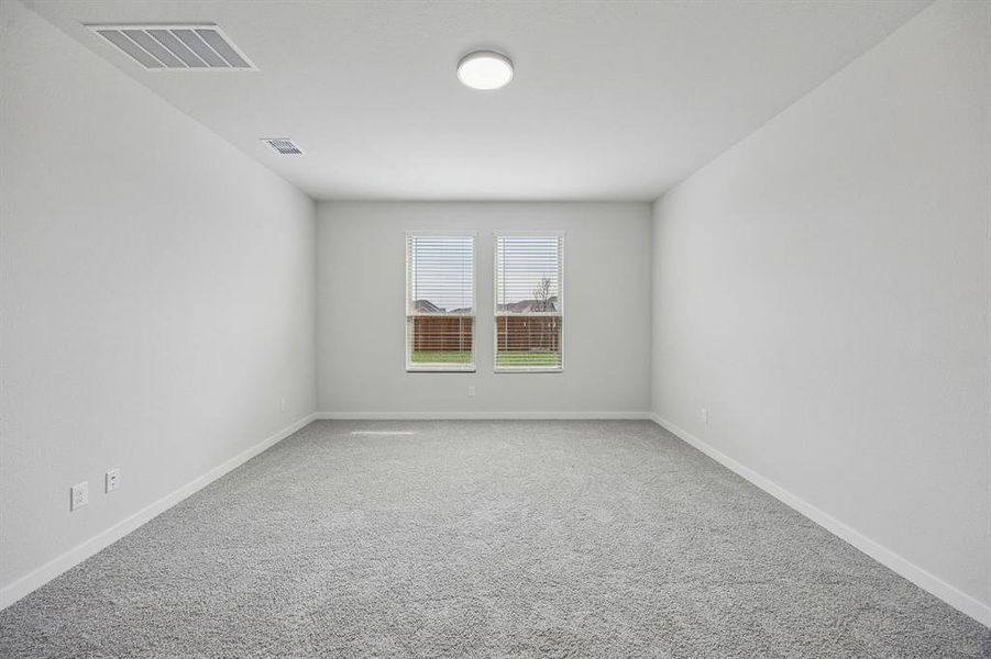 Primary Suite in the Masters home plan by Trophy Signature Homes – REPRESENTATIVE PHOTO