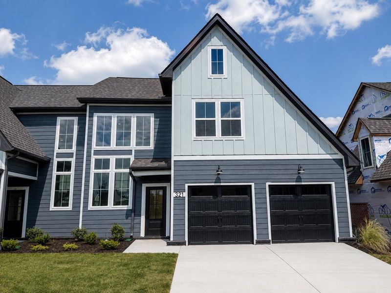Front exterior of a new home in Tiger Hill Townhomes, Murfreesboro, TN, highlighting curb appeal (Image 18). Front exterior of a new home in Tiger Hill Townhomes, Murfreesboro, TN, highlighting curb appeal (Image 18).