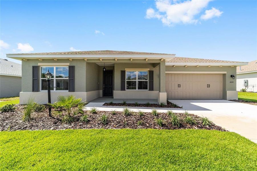 Front exterior of a new home in On Top of the World Communities, Ocala, FL, highlighting curb appeal (Image 18). Front exterior of a new home in On Top of the World Communities, Ocala, FL, highlighting curb appeal (Image 18).