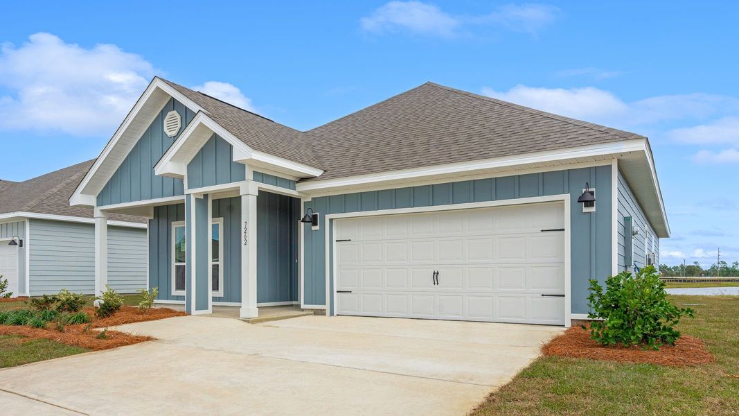 Front exterior of a new home in Hodges Bayou Plantation, Panama City, FL, highlighting curb appeal (Image 18).