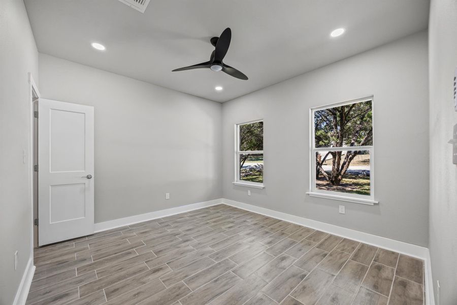 Unfurnished room featuring wood finish floors, recessed lighting, and ceiling fan Unfurnished room featuring wood finish floors, recessed lighting, and ceiling fan