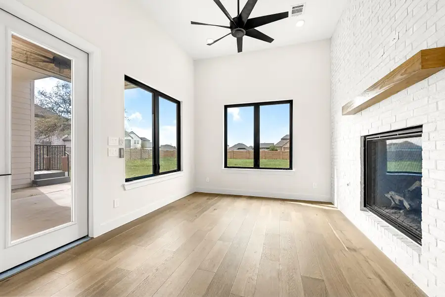 Primary suite w/ a sitting/extra room including a cozy fireplace.