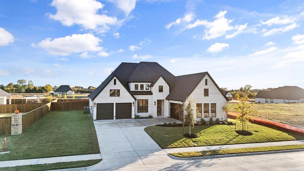 Modern farmhouse with driveway and a garage Modern farmhouse with driveway and a garage
