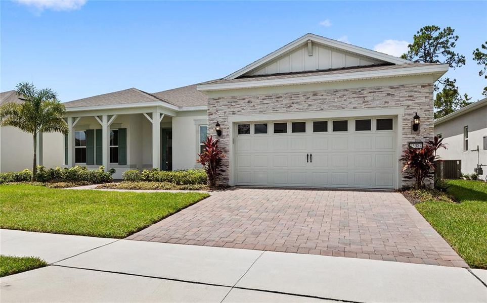 Front exterior of a new home in , Winter Garden, FL, highlighting curb appeal (Image 1). Front exterior of a new home in , Winter Garden, FL, highlighting curb appeal (Image 1).