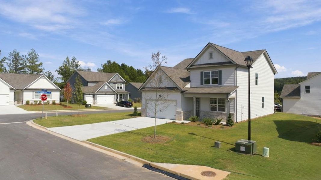 Front exterior of a new home in Fairway 17 at Mirror Lake, Villa Rica, GA, highlighting curb appeal (Image 1). Front exterior of a new home in Fairway 17 at Mirror Lake, Villa Rica, GA, highlighting curb appeal (Image 1).