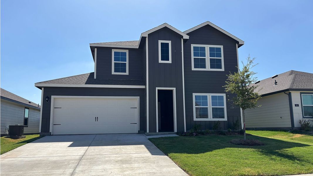 Front exterior of a new home in Wildwood, Royse City, TX, highlighting curb appeal (Image 1). Front exterior of a new home in Wildwood, Royse City, TX, highlighting curb appeal (Image 1).