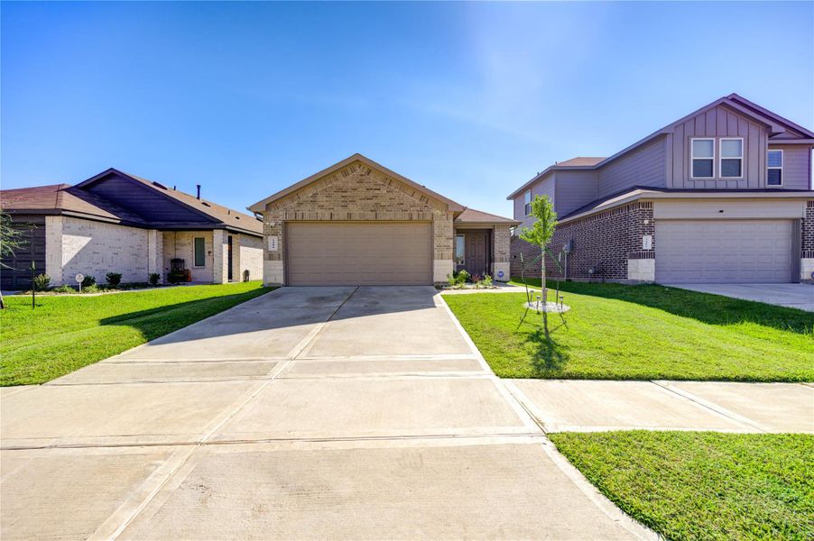 Front exterior of a new home in Breckenridge Forest, Spring, TX, highlighting curb appeal (Image 2).