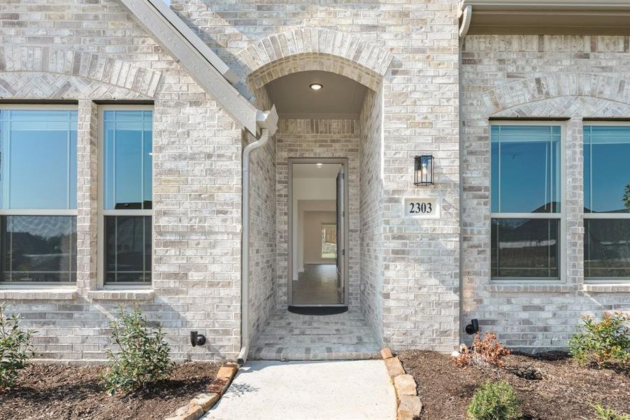 Front exterior of a new home in Rockwood 90, Mansfield, TX, highlighting curb appeal (Image 1). Front exterior of a new home in Rockwood 90, Mansfield, TX, highlighting curb appeal (Image 1).