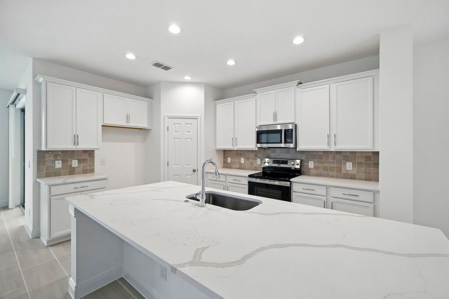 Representative furnished interior of a home built from the Wilshire Executive by Landsea Homes in Storey Creek, Kissimmee (Image 5).