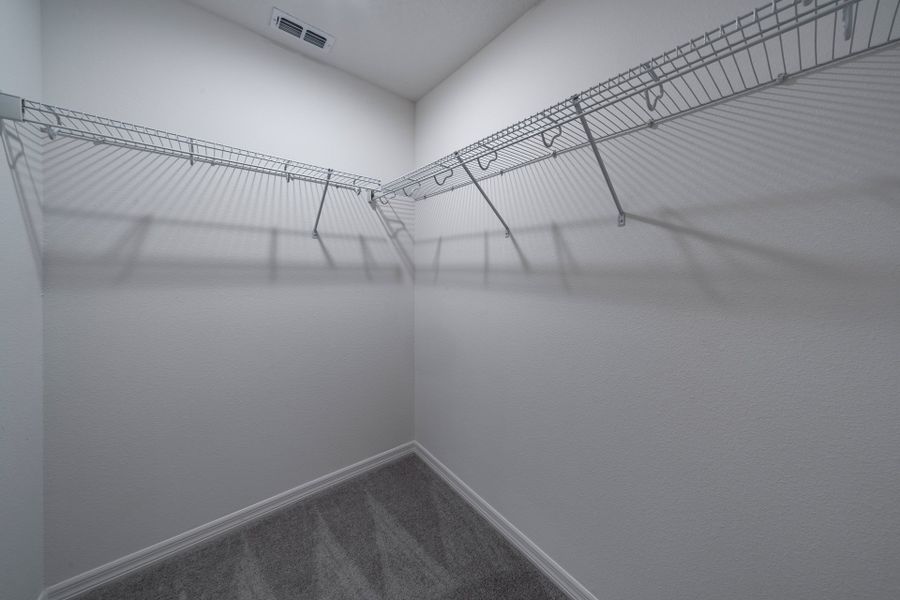 Spacious Primary Closet with Ample Storage in Central Florida Home Spacious Primary Closet with Ample Storage in Central Florida Home