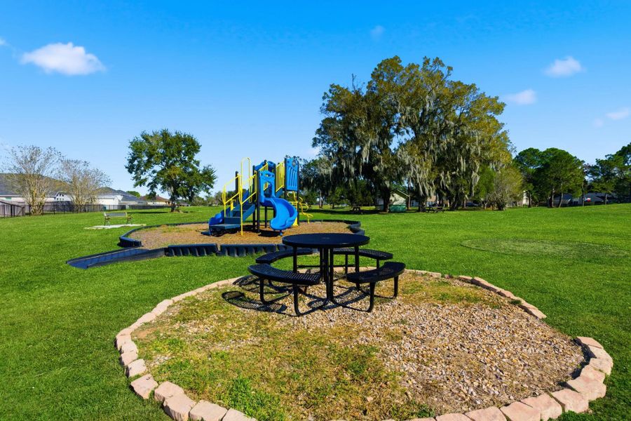 Fun for the whole family! The community playground and picnic area at Columbia Lakes offers a welcoming space for kids to play and families to gather. With open green fields, shady trees, and relaxing picnic spots, it’s the perfect place to enjoy a sunny Texas afternoon.