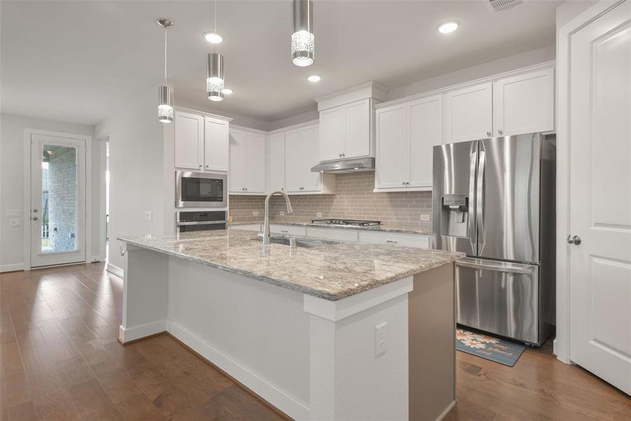 open kitchen concept with stainless steel appliances