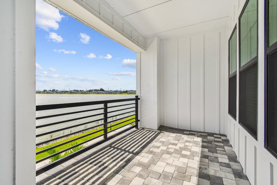 Exterior details and patio area of a home in Emerald Landing at Waterside at Lakewood Ranch – City Homes, Sarasota (Image 2).