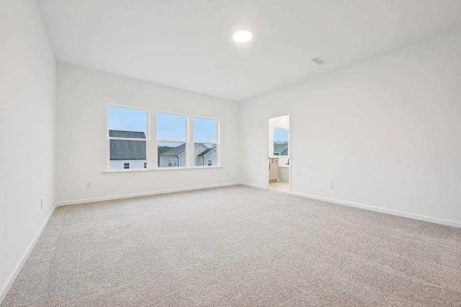 Primary Bed featuring the AW Collection® Foundry - A streamlined space for total rest.