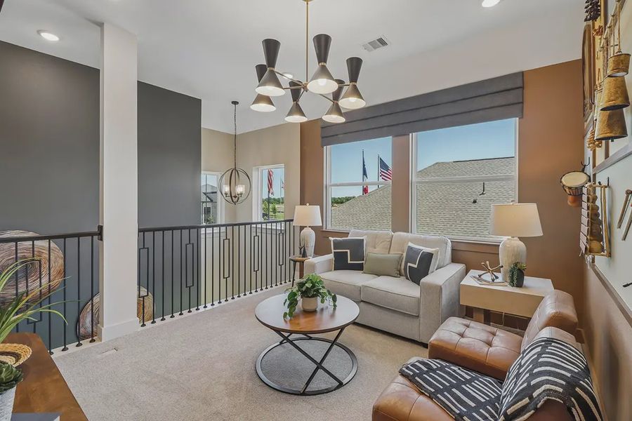 Furnished interior view inside a new home in Meridiana Chateau, Manvel (Image 22).