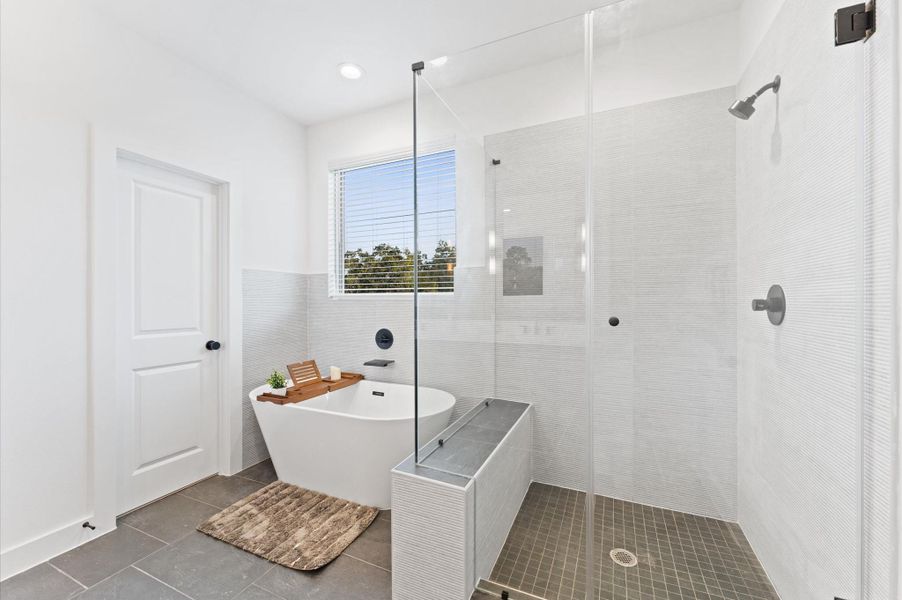 Primary bath. Photos are from a previous NJA Homes development. Floor plan, finishes & specifications may vary.