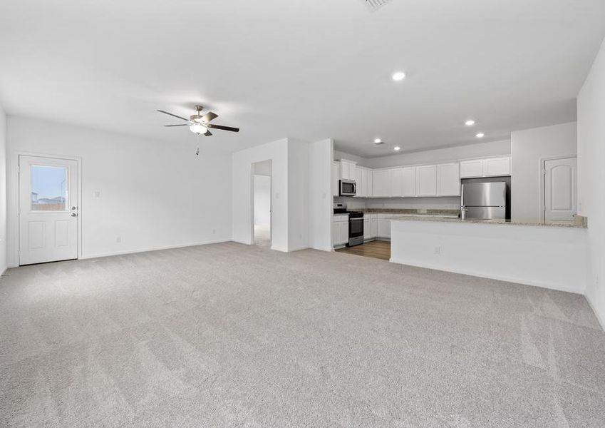 Spacious living room that connects to the kitchen and dining area.