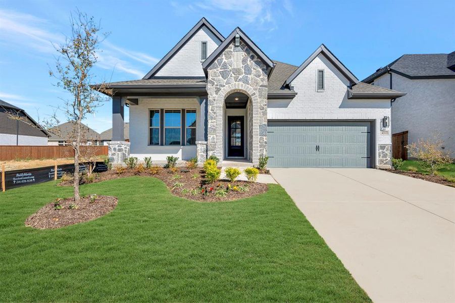 Front exterior of a new home in Sandbrock Ranch, Aubrey, TX, highlighting curb appeal (Image 1). Front exterior of a new home in Sandbrock Ranch, Aubrey, TX, highlighting curb appeal (Image 1).