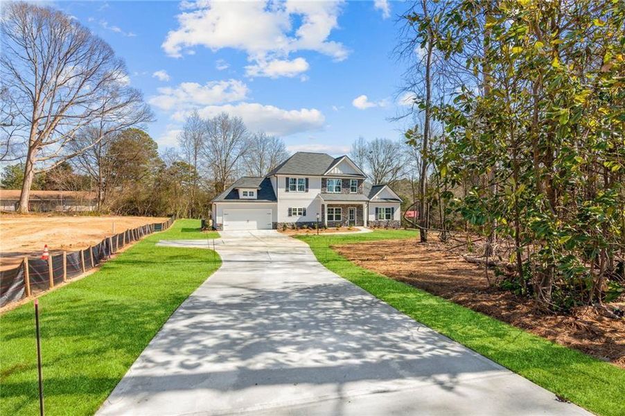 Front exterior of a new home in , Crawford, GA, highlighting curb appeal (Image 23).