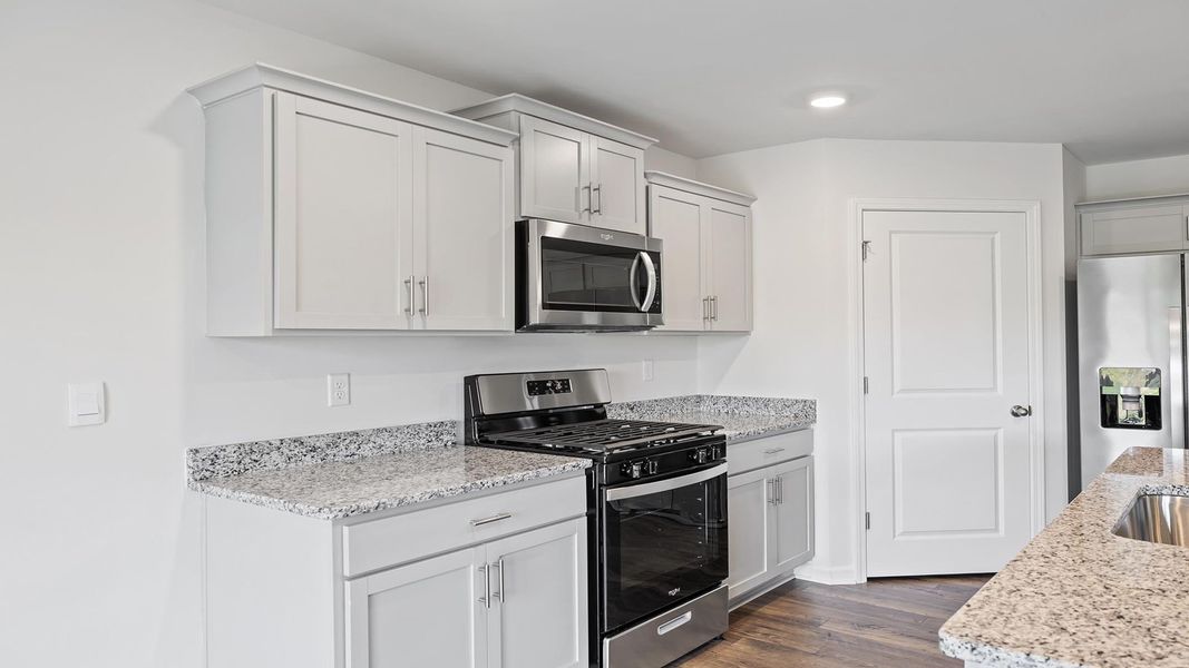 Furnished interior view inside a new home in Lakestone, Woodruff (Image 8).
