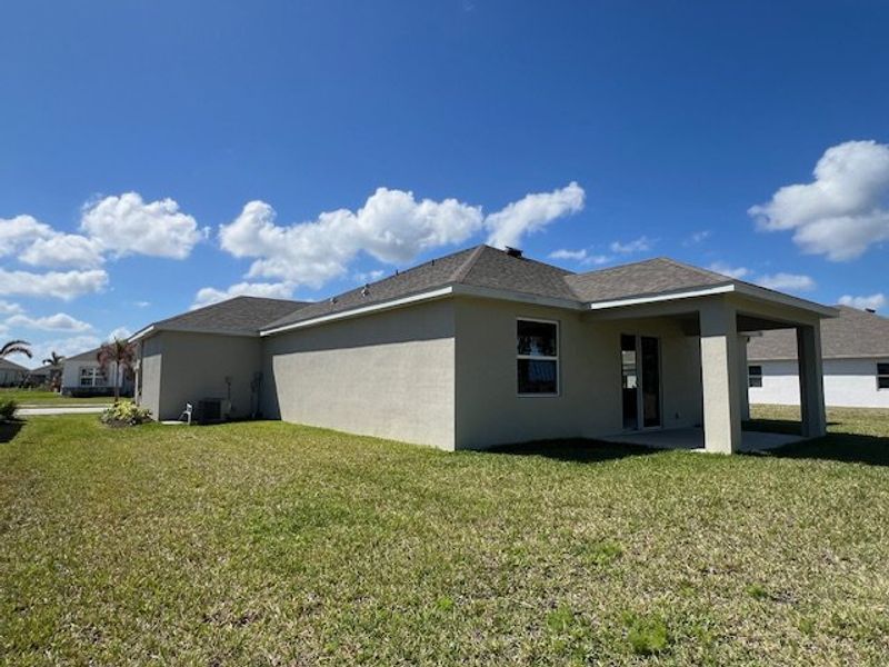 Exterior details and patio area of a home in Lakes At St Sebastian, Micco (Image 4).