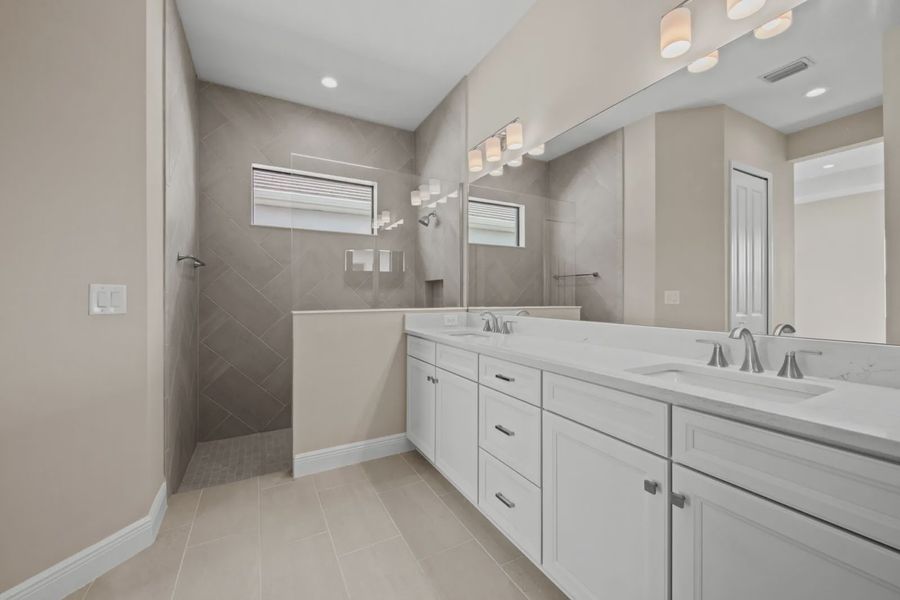 Representative furnished interior of a home built from the Eventide 4 by Neal Communities in SkySail, Naples (Image 5).