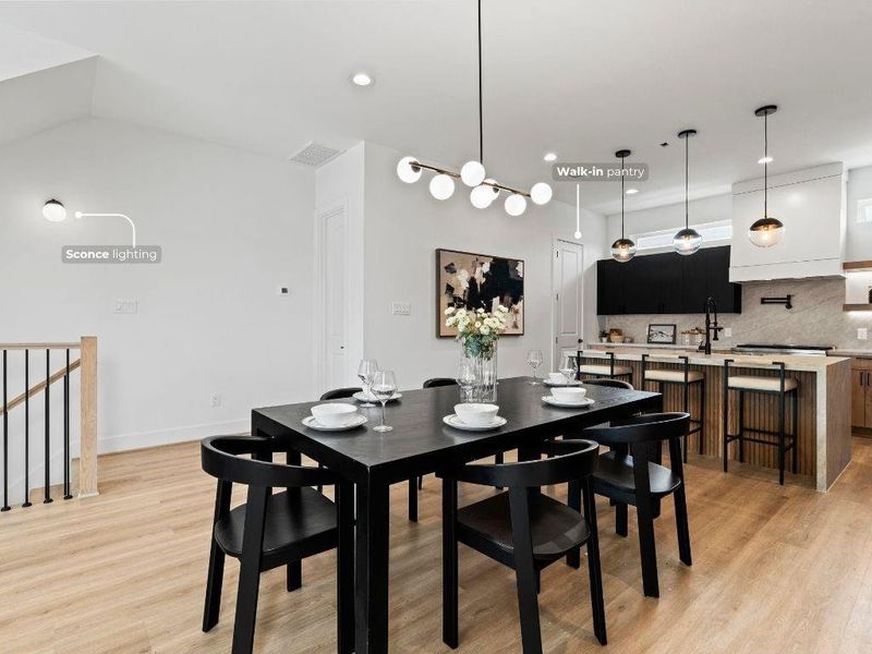 Another angle of the dining room, offering a glimpse of the discreetly tucked-away powder bath and pantry.