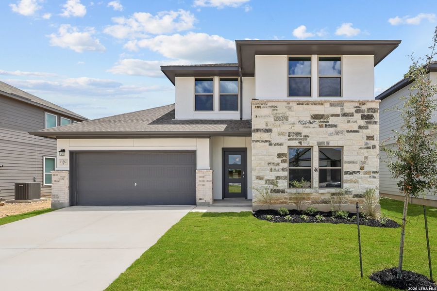 Front exterior of a new home in Summerlin, San Antonio, TX, highlighting curb appeal (Image 23). Front exterior of a new home in Summerlin, San Antonio, TX, highlighting curb appeal (Image 23).