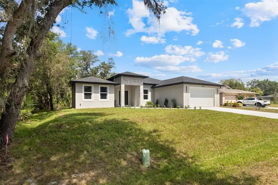Exterior details and patio area of a home in , Port Charlotte (Image 32).