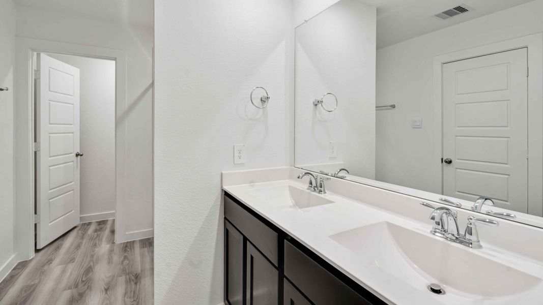 Representative furnished interior of a home built from the Hibiscus by D.R. Horton in City Gate North, Houston (Image 6).