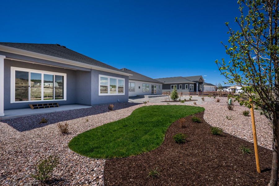 Exterior details and patio area of a home in Wolf Ranch - Enclave Collection, Colorado Springs (Image 4).