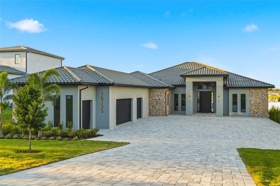 Front exterior of a new home in , Montverde, FL, highlighting curb appeal (Image 1).