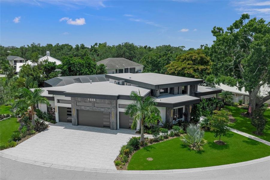 Front exterior of a new home in , Sarasota, FL, highlighting curb appeal (Image 2). Front exterior of a new home in , Sarasota, FL, highlighting curb appeal (Image 2).