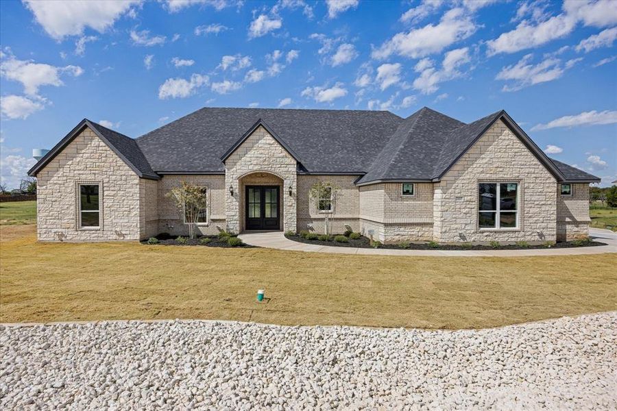 Front exterior of a new home in Pecan Plantation, Granbury, TX, highlighting curb appeal (Image 24).