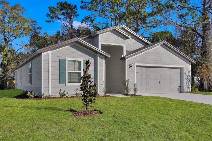Front exterior of a new home in , Palm Coast, FL, highlighting curb appeal (Image 14).