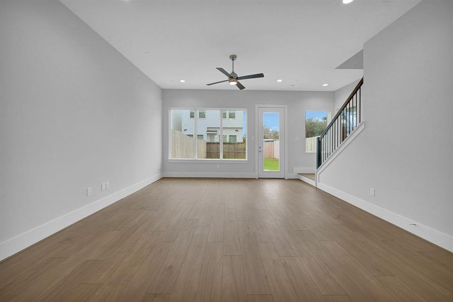 Natural light floods this entire area, enhancing the sense of space and connection throughout the home.