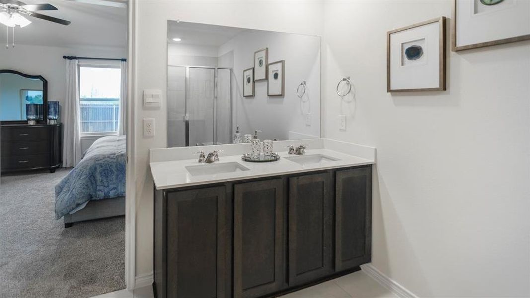Dual vanity with rectangular undermount sinks and a light-toned countertop